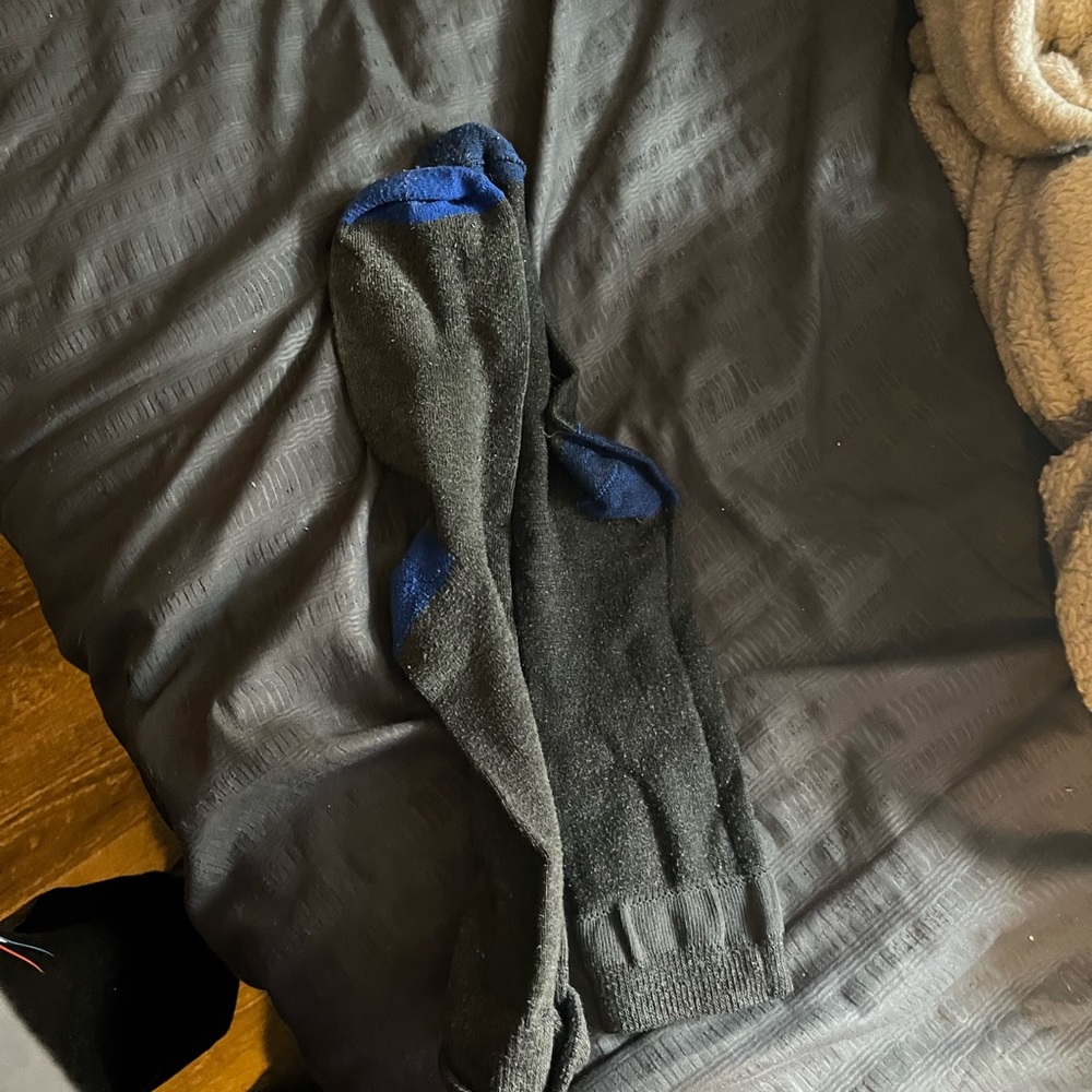Free with purchase of 2 or more. Black and blue socks.